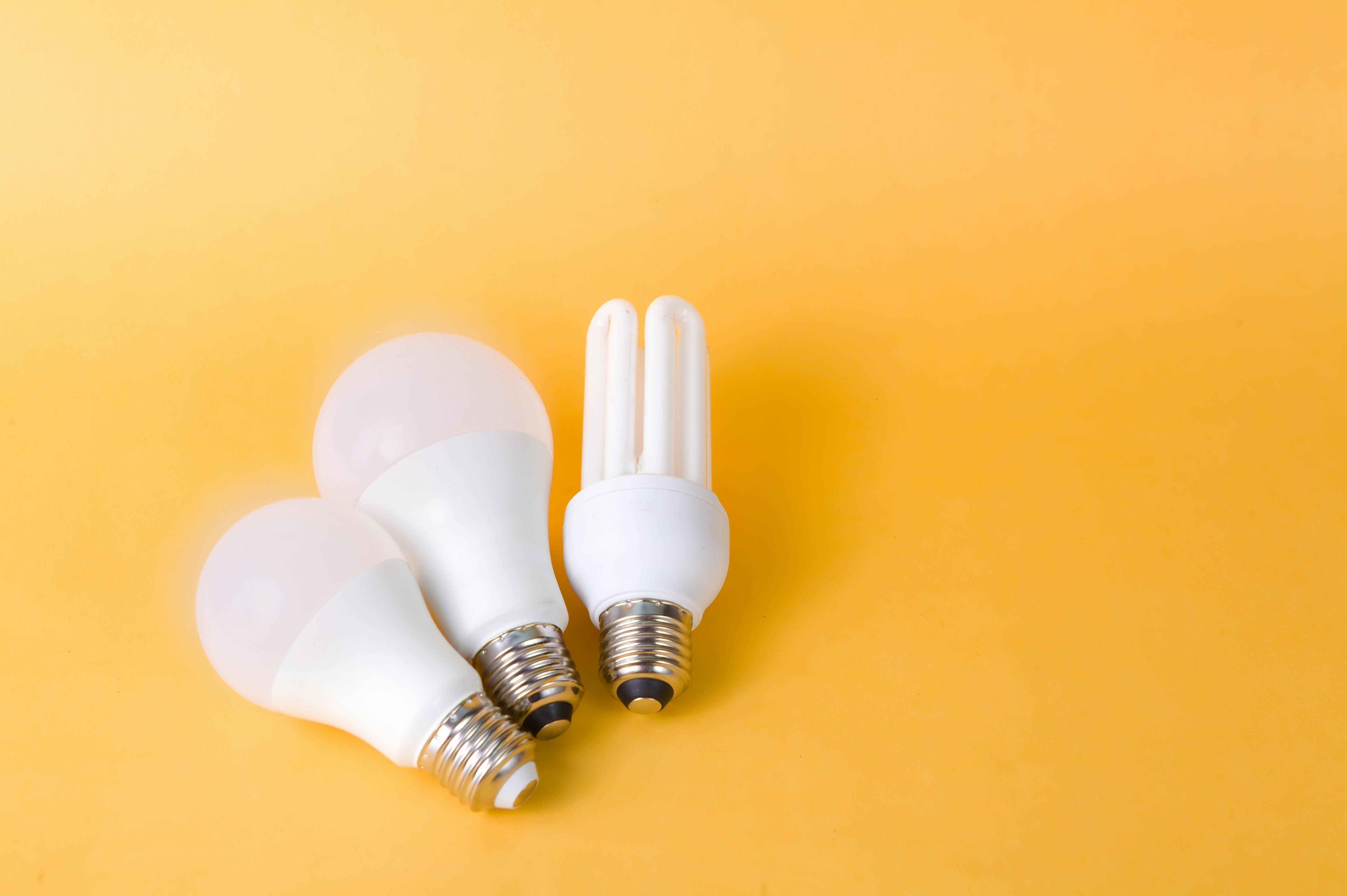 light bulbs laying on yellow surface