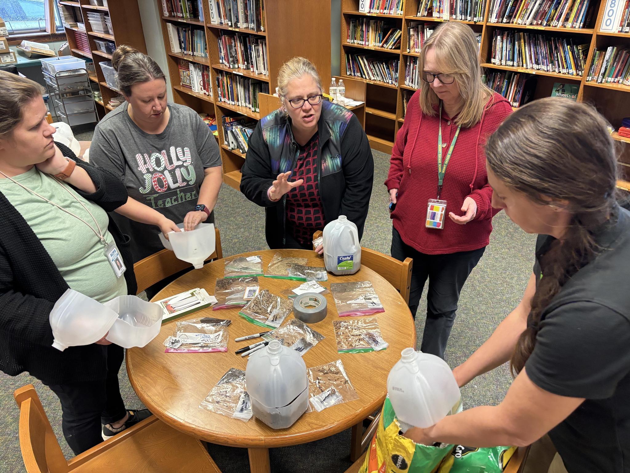 Group of people planting seeds 