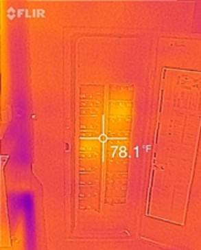 Thermal camera image of an open electrical breaker panel. Most breakers appear in warm orange and yellow tones, with a temperature reading of 78.1°F displayed at the center crosshair. Cooler areas are shown in darker purple and blue along the left side and around the panel edges. The image includes the FLIR logo in the upper-left corner.