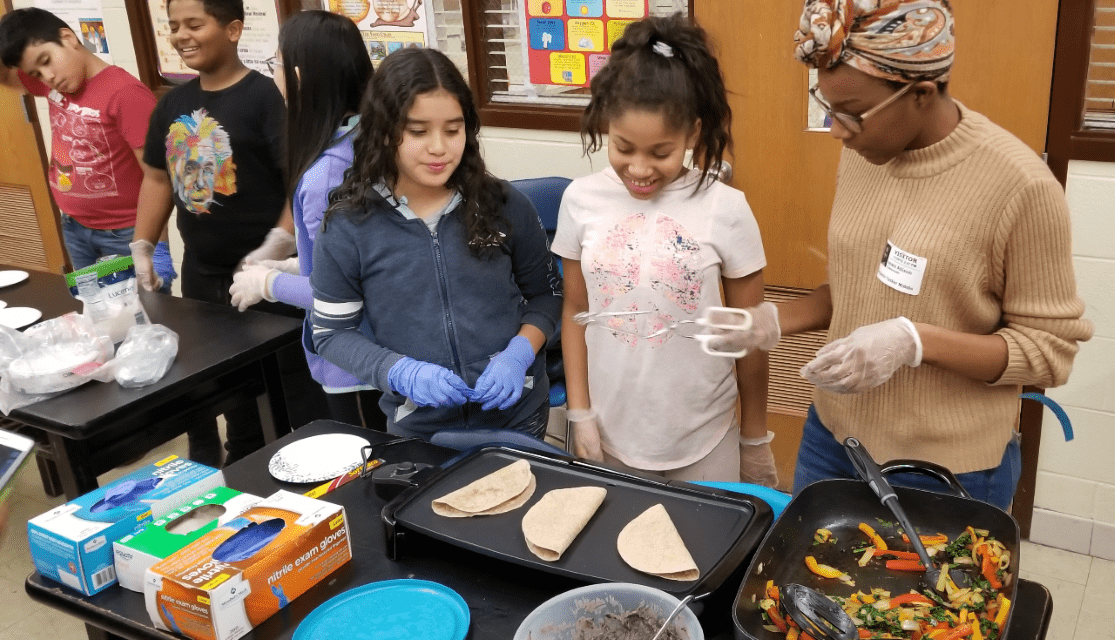EFNEP youth Cooking in a class