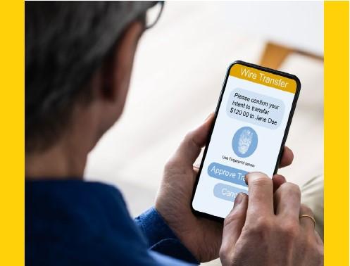 A mobile bank user meticulously verified the receiver’s information before initiating a wire transfer.