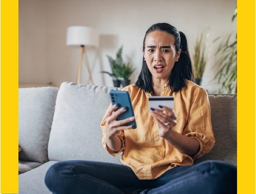 A mobile bank user recognizes an unfamiliar charge on her credit card