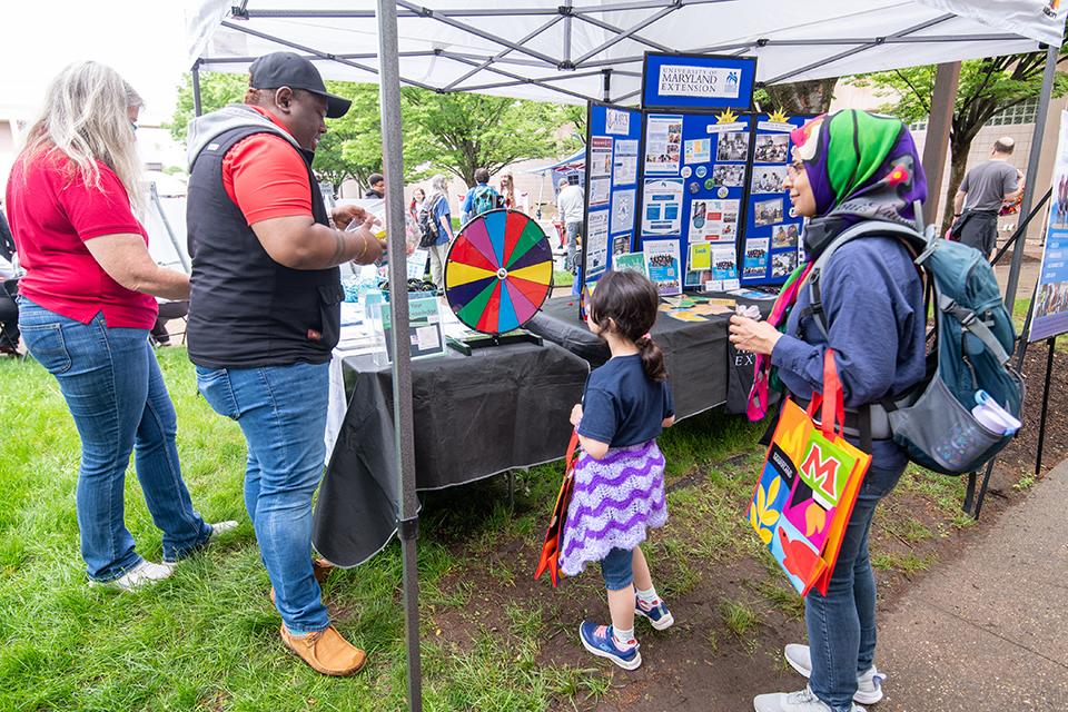 Maryland stakeholders visiting an Extension booth on Maryland Day.