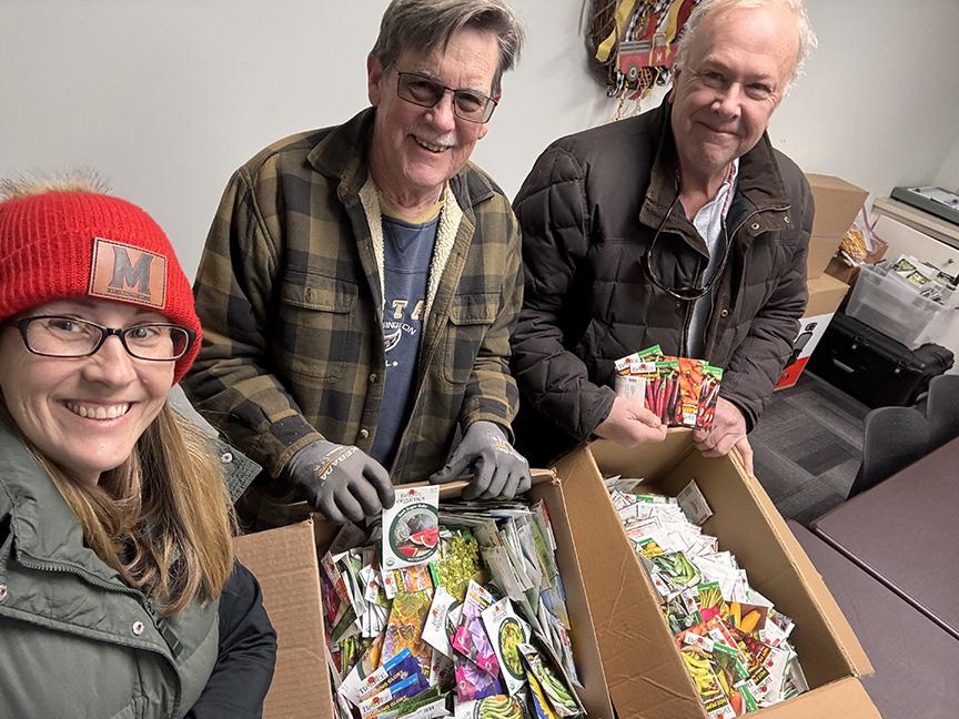 Rachel Rhodes and fellow Master Gardeners show off boxes of seeds donated by Ocean State Job Lot Charitable Foundation