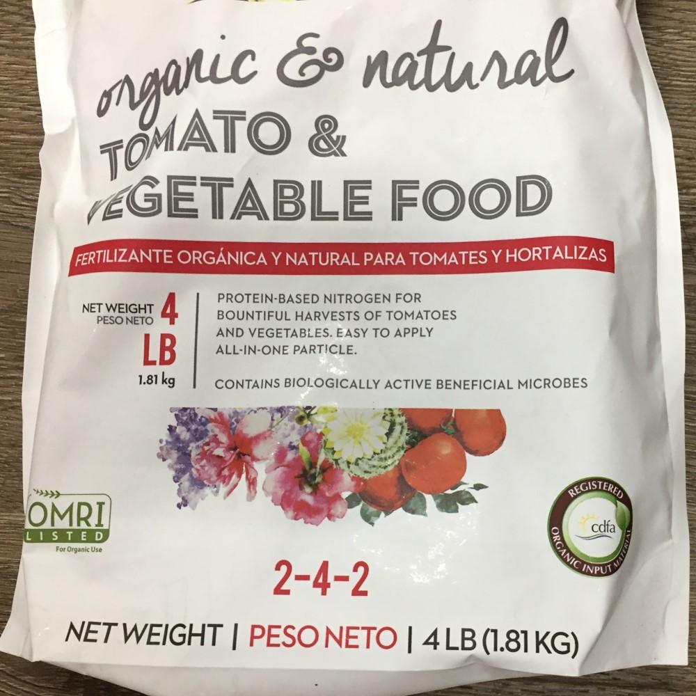 A 3-pound bag of organic fertilizer labeled “raised bed plant food” that has a nutrient analysis on the label of 10-2-8.