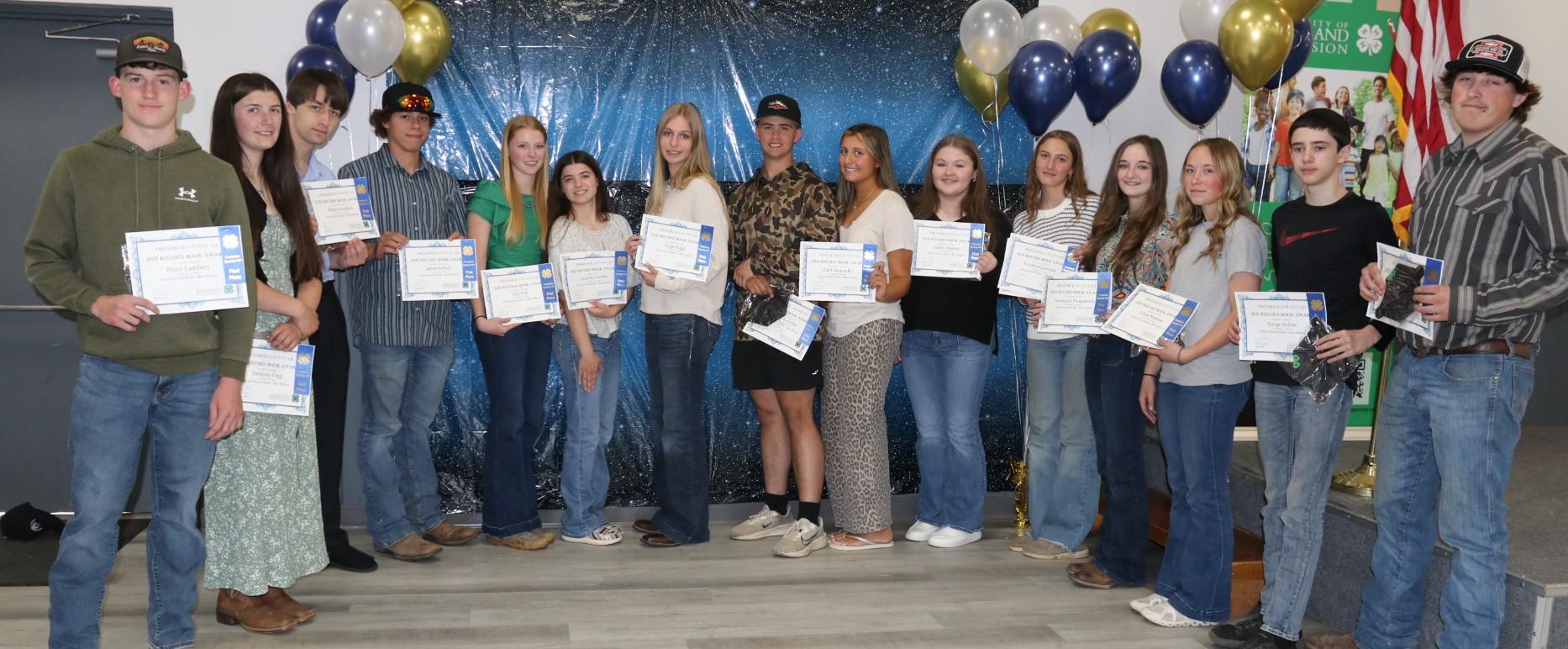 4-H members receiving awards at the annual awards ceremony
