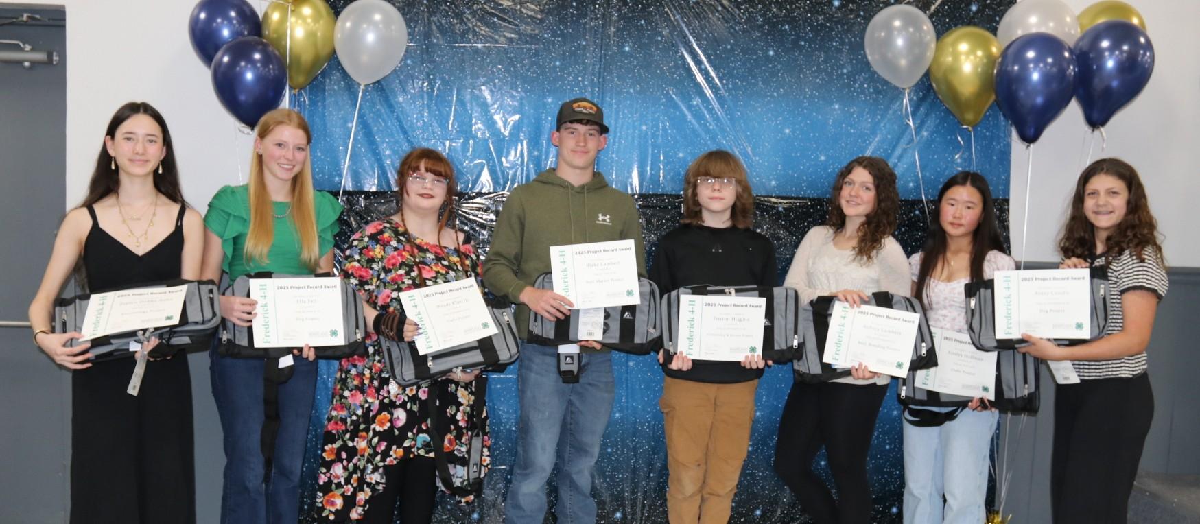 4-H members receiving awards at the annual awards ceremony